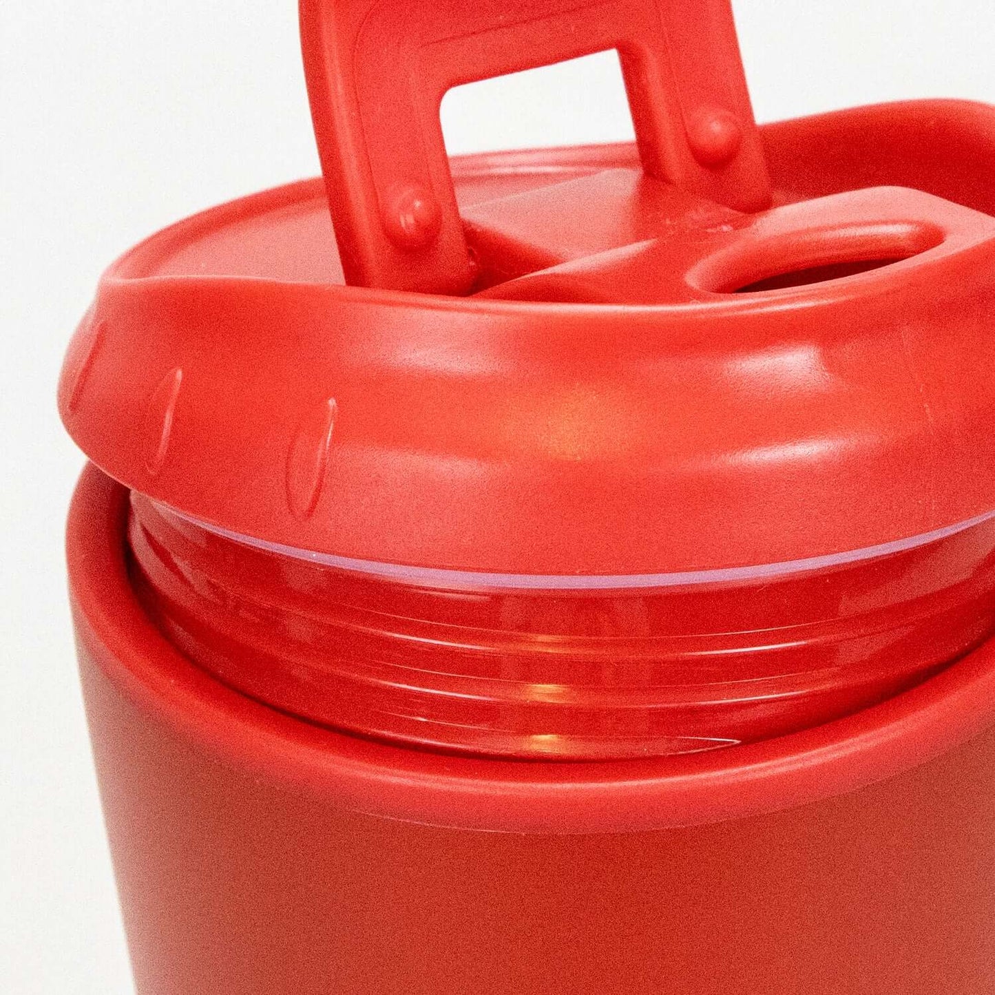 Top view of Corsica Coffee Cup with red flip closure lid and double wall design.