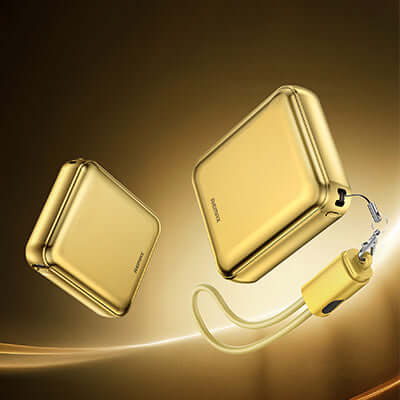 Remax FCP-9 Mini Powerbank 10000mAh in gold color with attached lanyard, showcasing its elegant design.