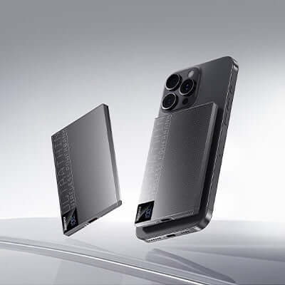 Remax MP-5 Magnetic Wireless Charging Powerbank 5000mAh next to a smartphone on a sleek surface.