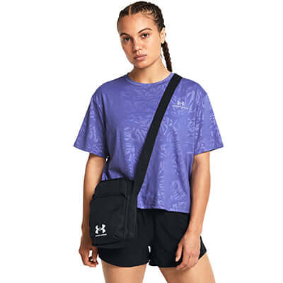 Under Armour Essential Lite Crossbody Bag worn by a model, showcasing style and functionality.