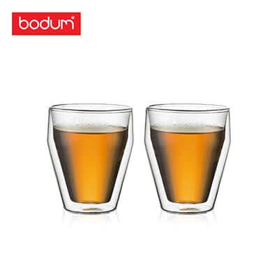 Bodum Titlis 2pcs DW Glass 0.25L Stackable with amber beverage, elegant design for corporate gift.