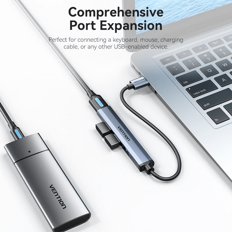 Vention 4-in-1 USB 3.0 Mini Hub connected to laptop for comprehensive port expansion.