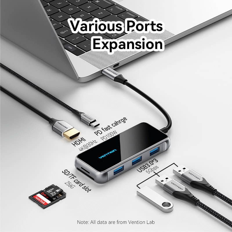 Vention 7-in-1 USB-C USB Hub connected to a laptop, showcasing various ports for expansion.