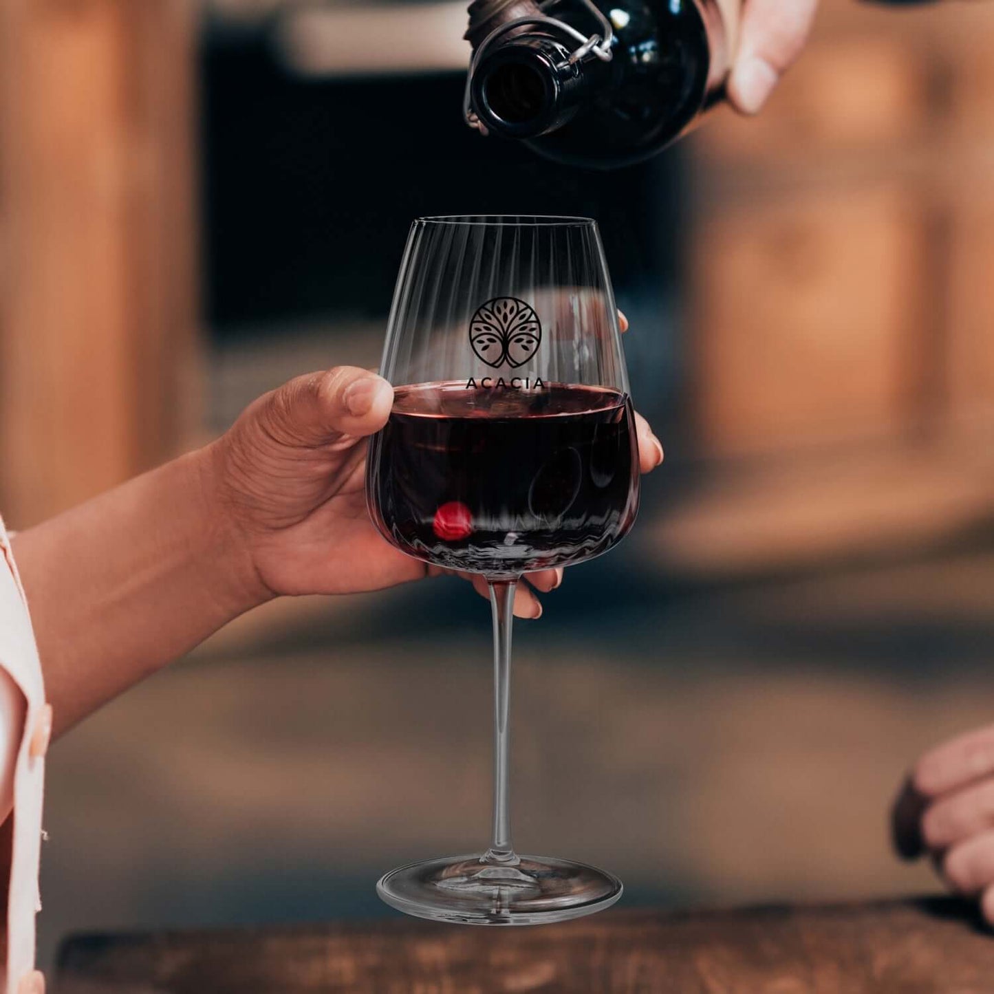 Luigi Bormioli Optica Bordeaux Glass filled with red wine, perfect for a corporate gift Singapore.