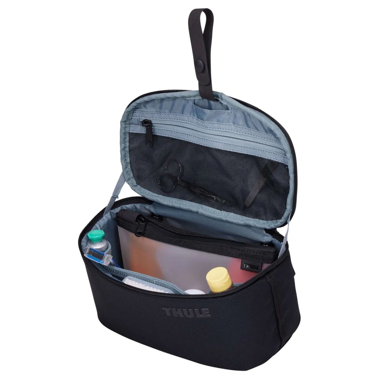 Thule Subterra 2 Toiletry Case open showing organized compartments for toiletries and travel essentials.