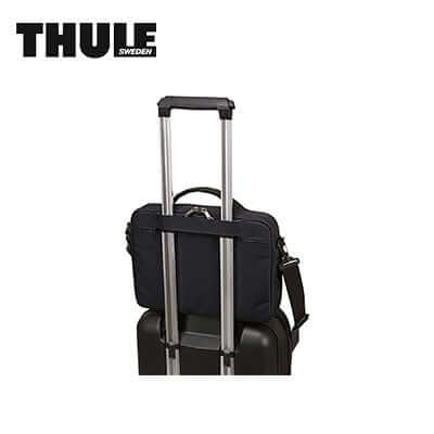 Thule Subterra MacBook Attaché 13" Laptop Bag attached to wheeled luggage for convenient travel.