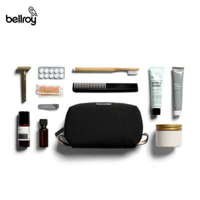 Bellroy Dopp Kit with toiletries, including toothbrush, comb, and grooming products for a stylish travel experience.