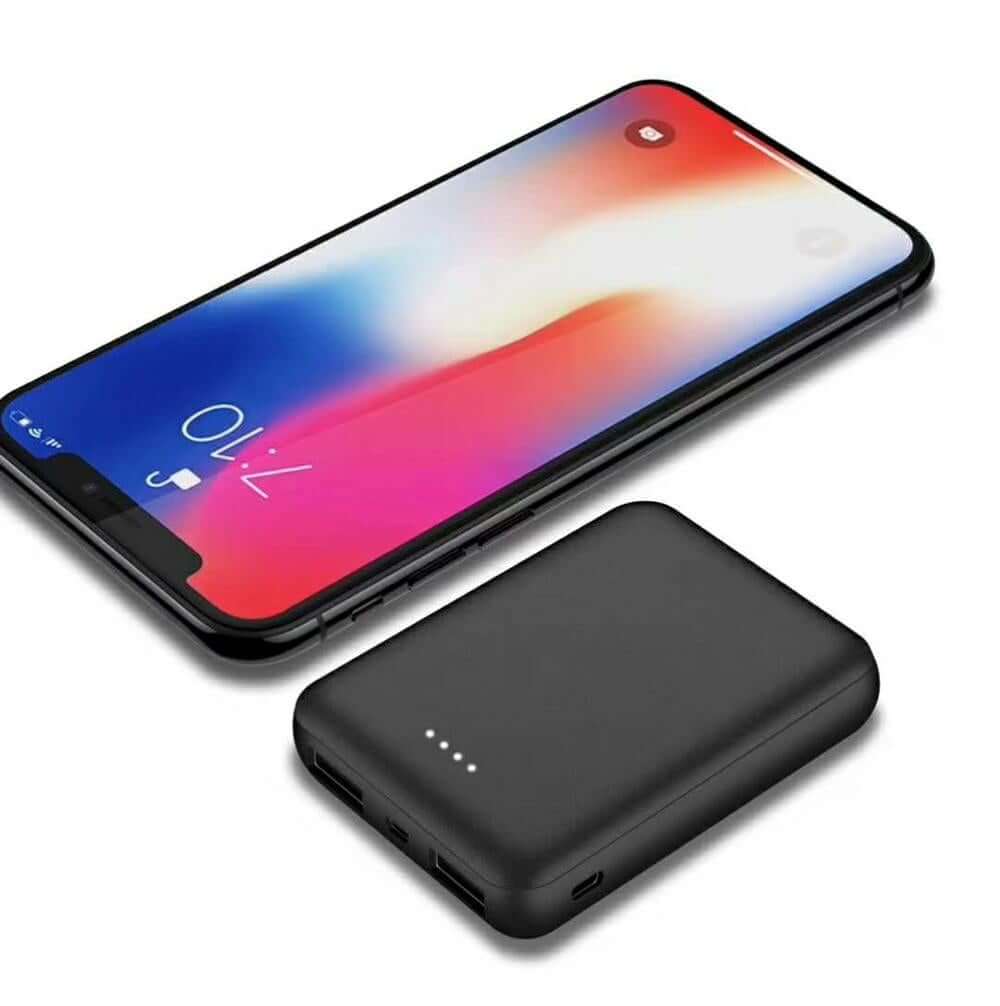 10000mAh Portable Mini Power Bank next to a smartphone, showing compact design for easy portability.