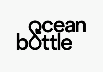 Ocean Bottle Premium Flasks in sleek colors displayed on a rock, perfect for corporate gift collection.