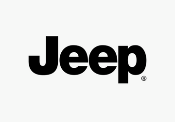 Jeep wireless earbuds collection in black, cream, and green cases on a flat surface.