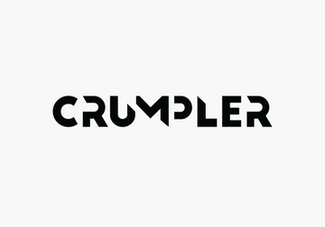 Crumpler bag in brown with red strap set against Machu Picchu backdrop, ideal for corporate gift.