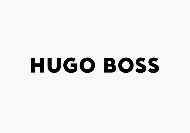 Hugo Boss black wallet held in hand, a stylish corporate gift for visionaries and achievers.