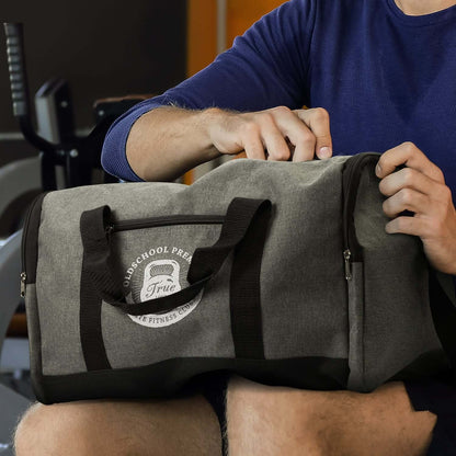 Man opening a Milford Duffle Bag made from durable poly-canvas fabric, ideal for fitness and travel.