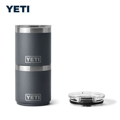 Yeti Rambler® 10 oz Stackable Lowball Cup next to its lid, perfect for gifts and keeping drinks at the ideal temperature.