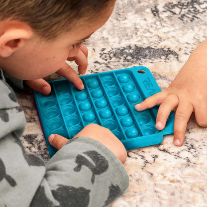 Kids enjoying the fun and therapeutic Pop Bubble Board fidget toy to reduce stress.