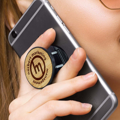 Bamboo Phone Holder attached to a smartphone, showcasing its stylish grip and corporate gift potential.
