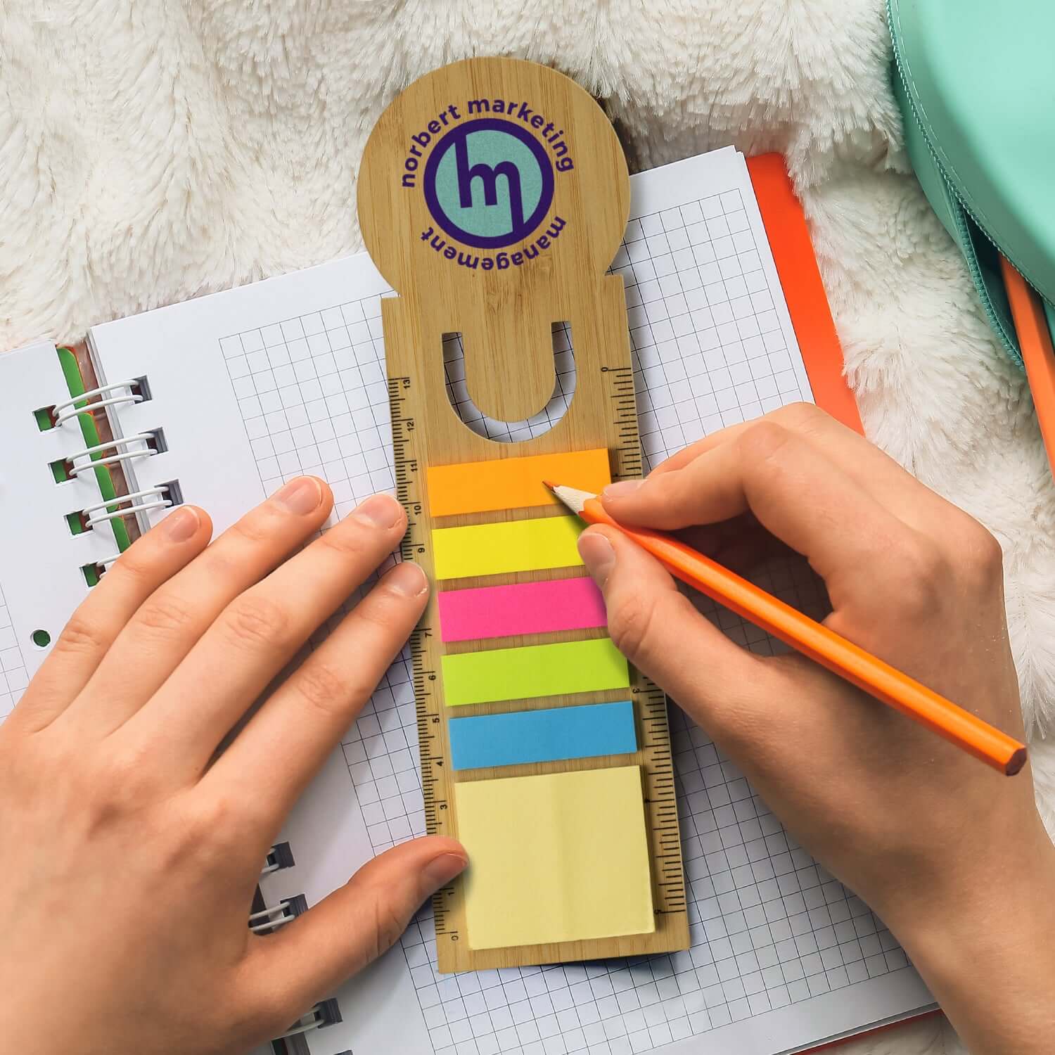 Bamboo Ruler Bookmark Round with adhesive flags and sticky notes on a notebook for students and professionals.