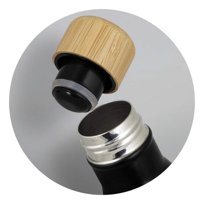 Close-up of the bamboo lid and opening of the Mirage Vacuum Bottle with Bamboo Lid, highlighting its elegant design.