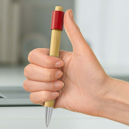 Unwind Bamboo Spinner Pen held in hand, showcasing eco-friendly bamboo design, ideal for corporate gifts.