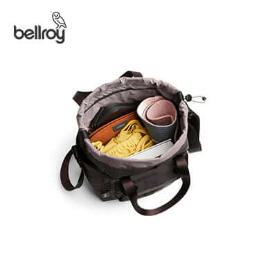 Bellroy Cinch Bucket Bag showcasing its spacious interior with organized items, ideal for a stylish corporate gift.