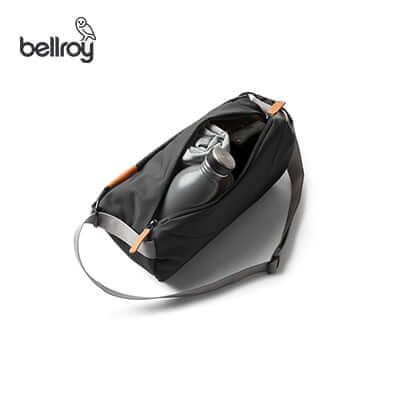 Bellroy Sling Mini bag with water bottle and zip close, ideal corporate gift for versatility and style.