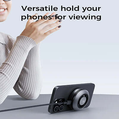 Aukey LC-G10 Qi2 Magnetic Fast Wireless Charging Active Cooling with Magnetic Ring in use, holding a phone for viewing.