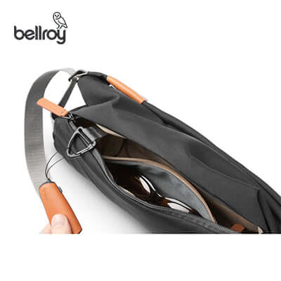 Bellroy Sling Mini interior showcasing organized compartments and soft-lined sunglasses pouch.