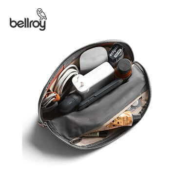 Bellroy Desk Caddy showcasing tech essentials and office items organized inside a stylish pouch.