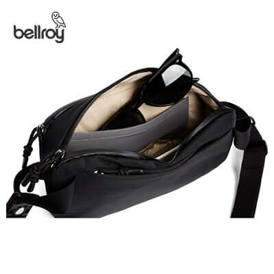 Inside view of Bellroy Venture Ready Sling 2.5L showcasing organized compartments and sunglasses.
