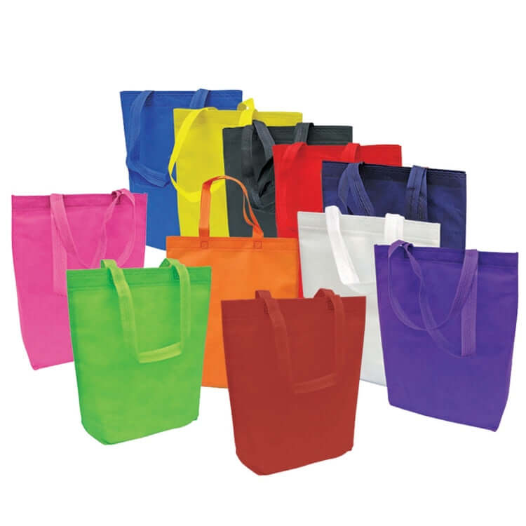 Colorful assortment of 80gsm Non Woven Bags in various shades for eco-friendly carrying options.