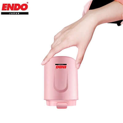 Endo 250ml Coffee Mug in pink being held; perfect corporate gift for coffee lovers.