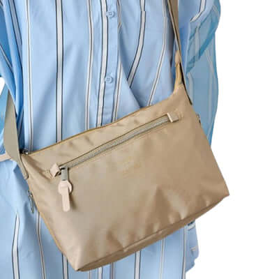 Anello Three Mini Shoulder Bag in beige, a stylish and functional accessory with silver zip and outer pockets.