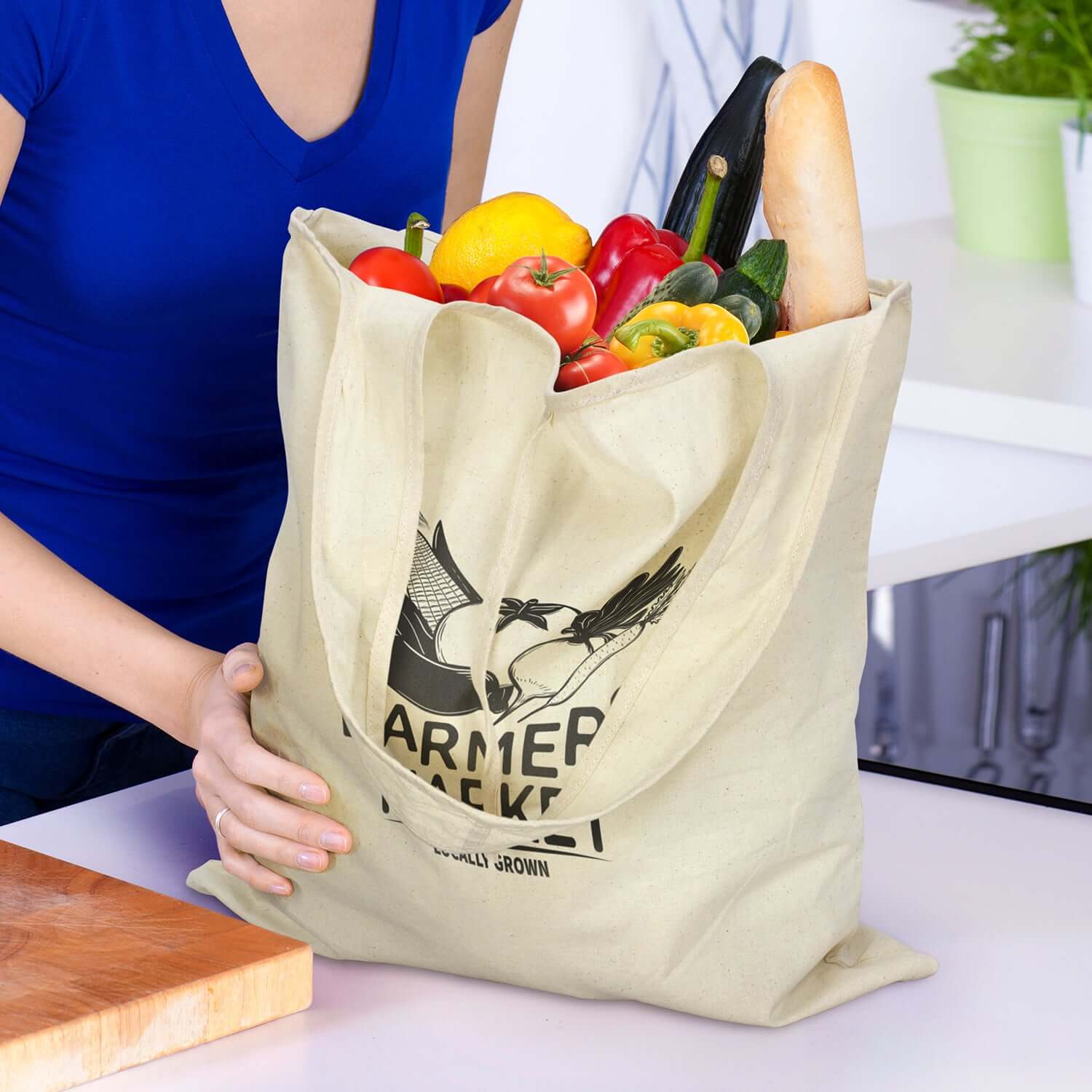 Matakana Foldaway Tote Bag filled with fresh vegetables and bread, perfect for eco-friendly shopping.