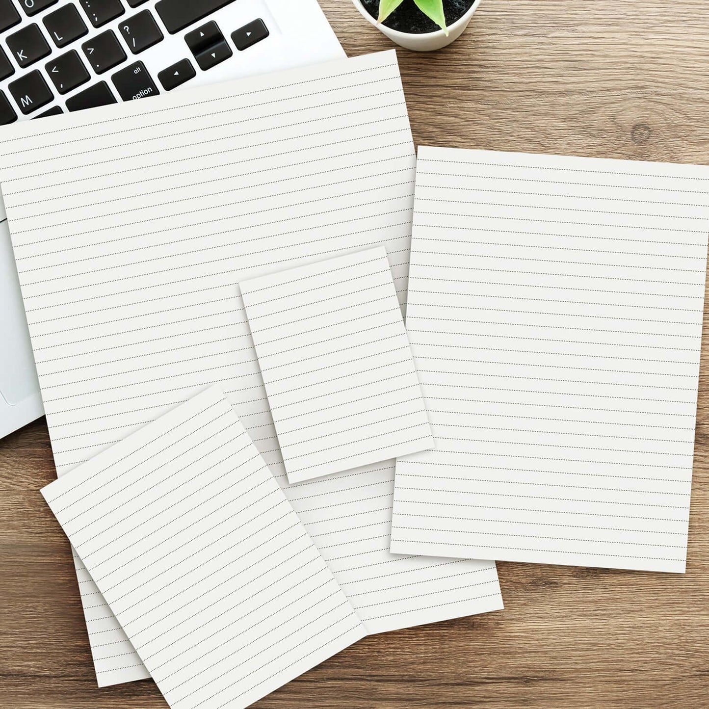 Office Note Pad - A4 on a wooden desk next to a laptop, showcasing lined pages for organized notes.
