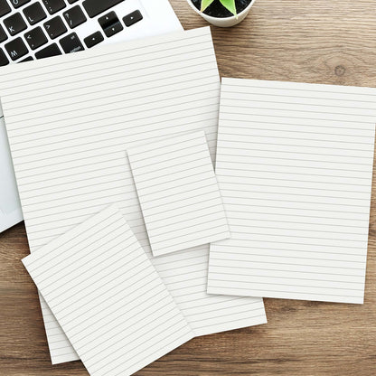 Office Note Pad - A4 on a wooden desk next to a laptop, showcasing lined pages for organized notes.