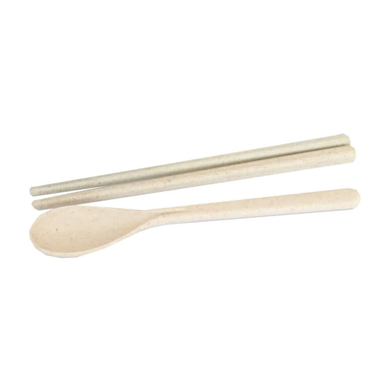 Eco-friendly cutlery set including chopsticks and spoon made from biodegradable materials.