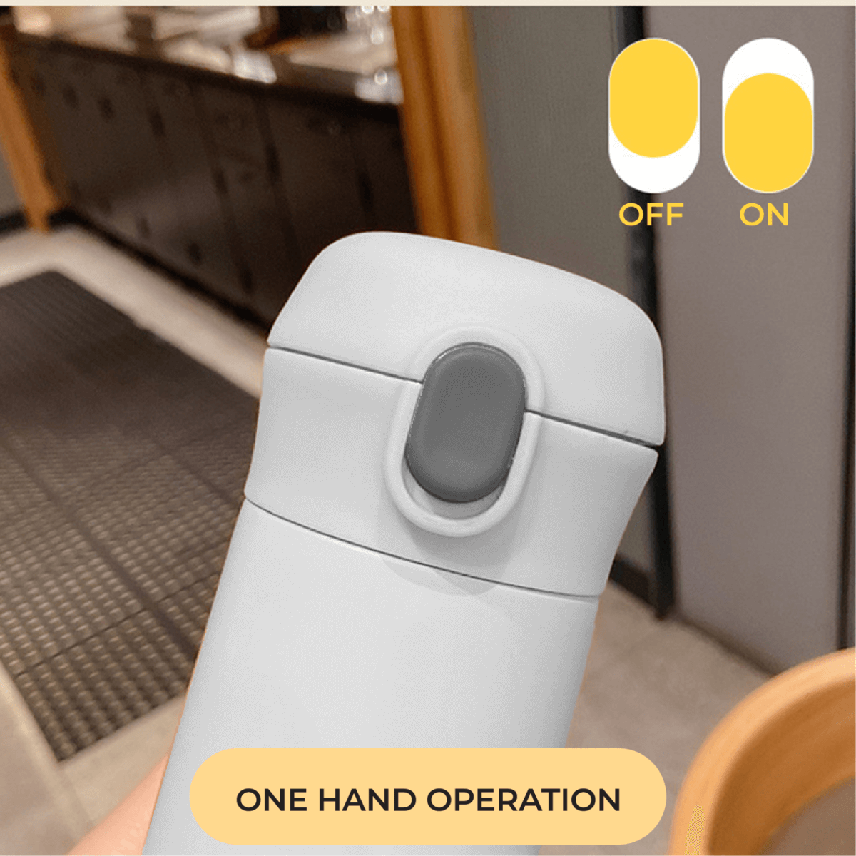 Charmy 500ml Stainless Steel Vacuum Flask with Handle demonstrating one-hand operation feature.