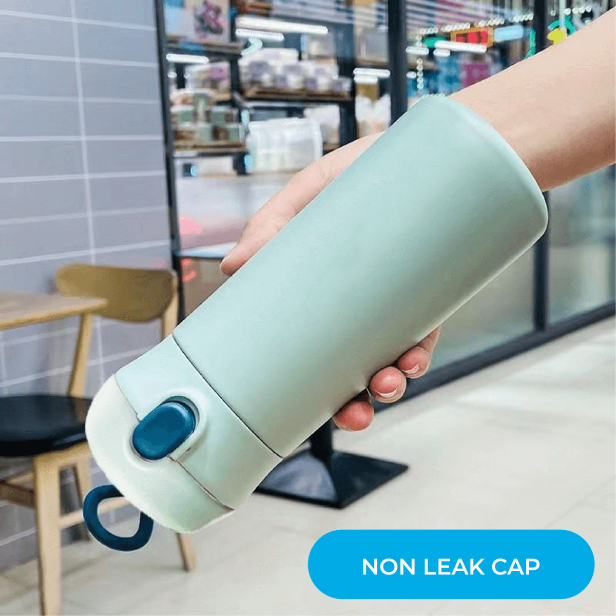 Charmy 500ml Stainless Steel Vacuum Flask with Handle in hand featuring non-leak cap design.