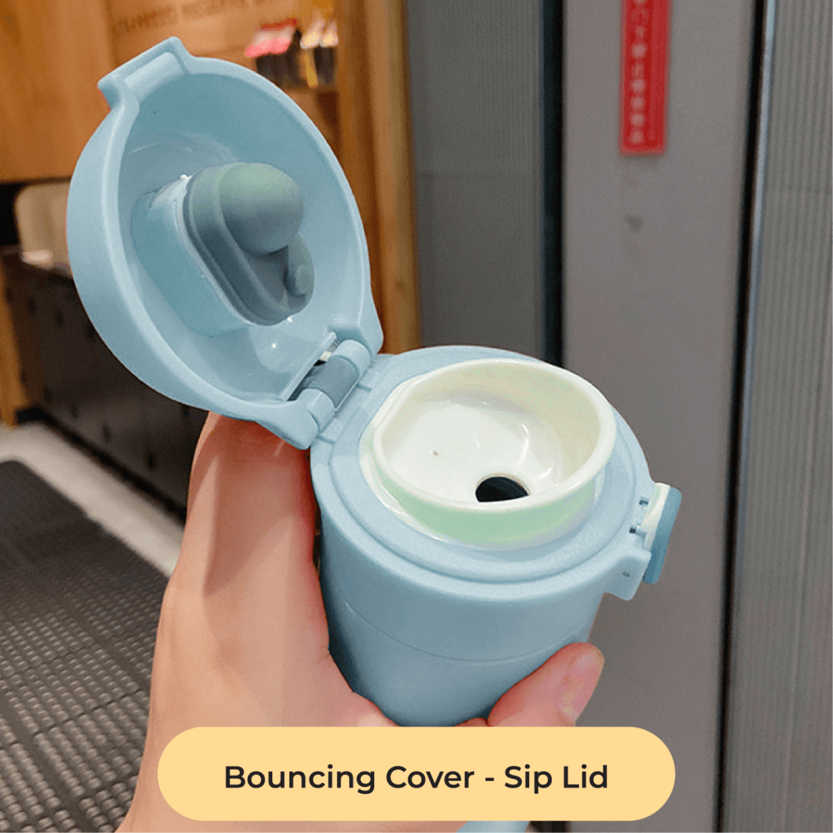Charmy 500ml Stainless Steel Vacuum Flask with Handle showing the Bouncing Cover Sip Lid feature.