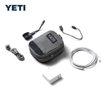 Yeti CROSSROADS™ Packing Cube - Small with cables, charger, and tech accessories for organized travel.