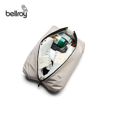Bellroy Lite Packing Caddy 10L filled with shoes and essentials, perfect for organization and travel, ideal as a Corporate Gift.