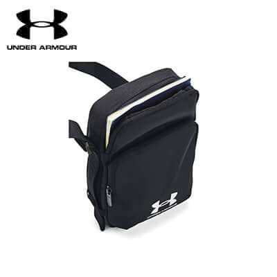 Under Armour Essential Lite Crossbody Bag showcasing its sleek design and front pocket for easy access.