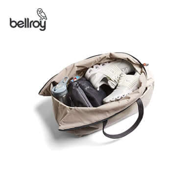 Bellroy Lite Duffel Bag filled with shoes and essentials, perfect as a corporate gift.
