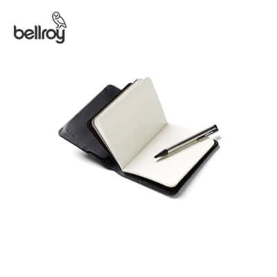 Bellroy Notebook Cover + Notebook open with pen, perfect for travel and corporate gift ideas.