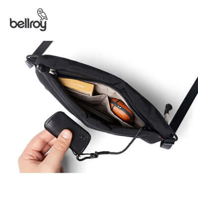 Interior view of the Bellroy Lite Sacoche Sling Bag showing items and pockets, ideal for everyday use and travel.