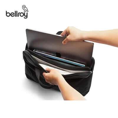 Bellroy Tokyo Laptop Bag 16" with laptop being inserted, ideal for corporate gift and daily commuting needs.
