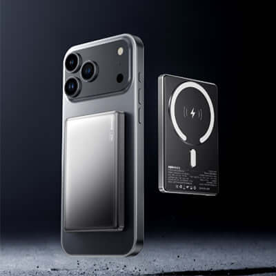 Remax CX09 Magnetic Powerbank 10000mAh attached to smartphone with wireless charging capability.