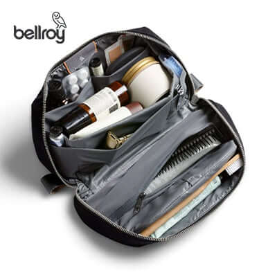 Bellroy Toiletry Kit Plus filled with travel essentials, showcasing pockets for organization.