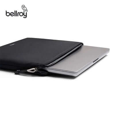 Bellroy Lite Laptop Sleeve 16" with a laptop, showcasing its sleek design and protective features.