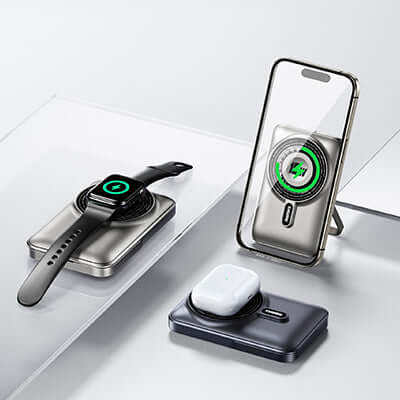 Remax RPP-695 Wireless Charging Powerbank 10000mAh with smartwatch and earbuds charging on a sleek surface.